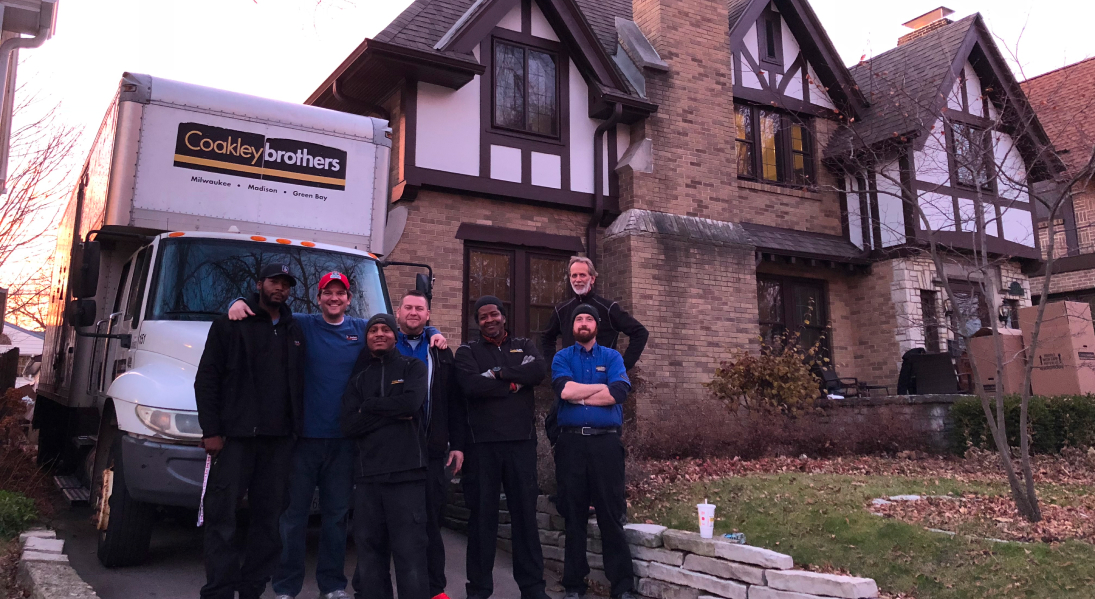 Coakley Brothers team outside of a home